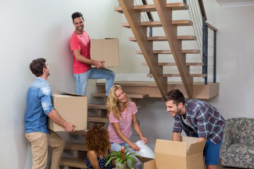 Professional packing services organizing moving boxes in Northkensington