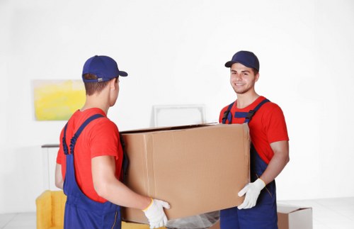 Professional removal team planning a move in North Kensington