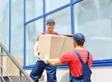 Moving boxes and furniture prepared for a North Kensington relocation