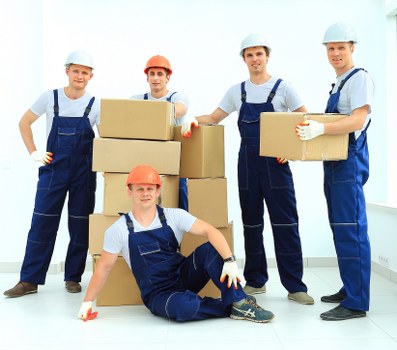 Expert movers packing fragile belongings for relocation in Northkensington