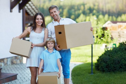 Professional flat removals in North Kensington with careful loading outside an apartment building