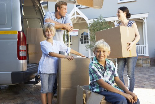 Man and van team handling household items in North Kensington