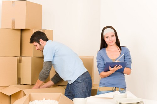 Loading furniture into a North Kensington removal van